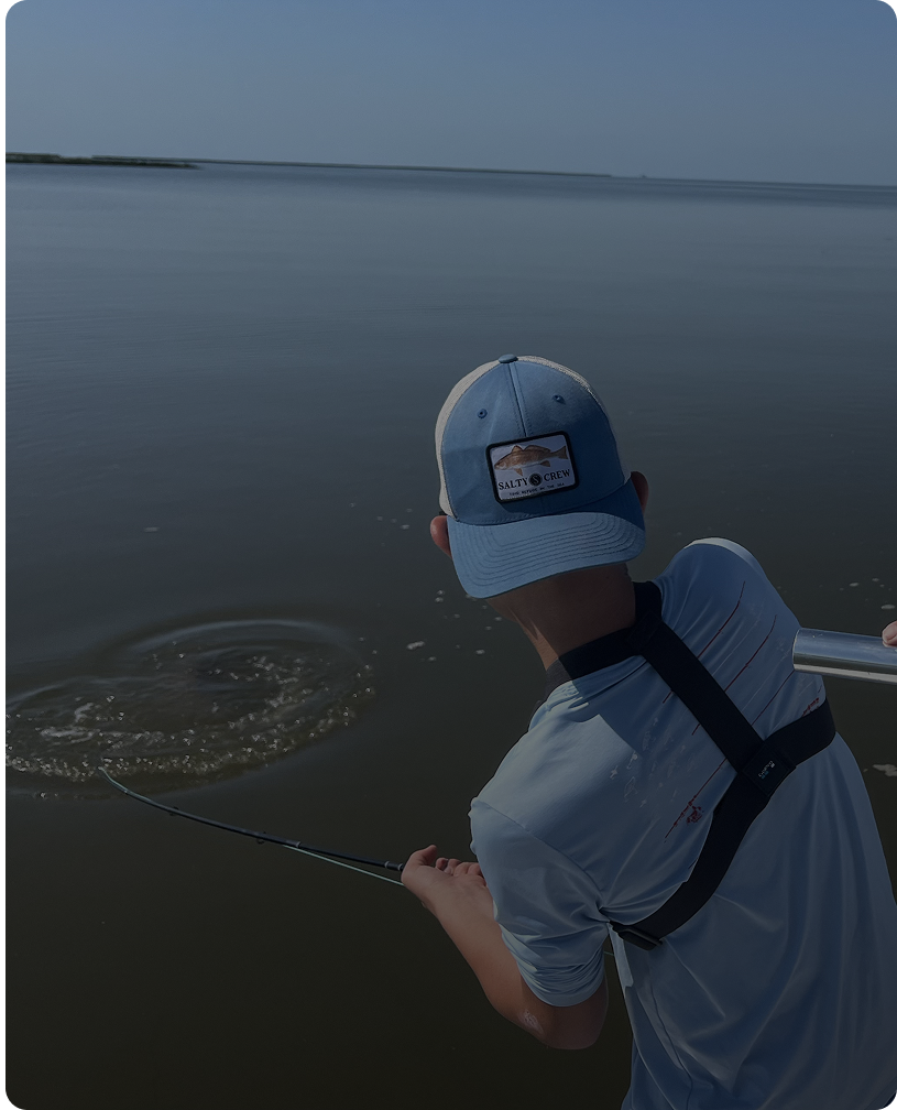 Person fishing in calm waters