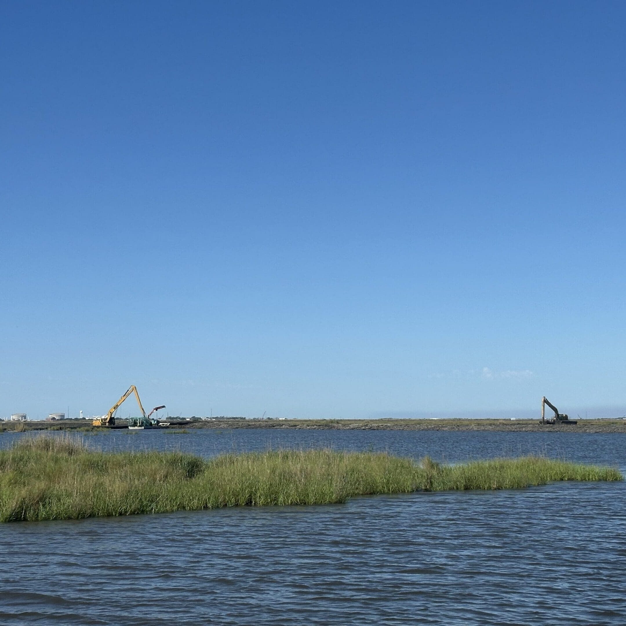 Waterfront scene with construction equipment