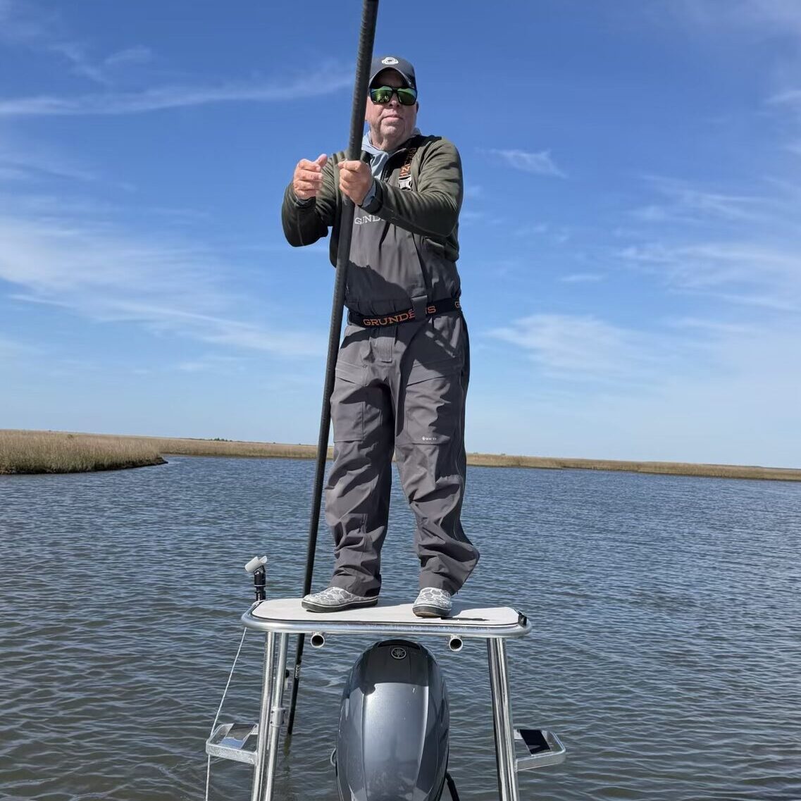 Fisherman on boat in open water